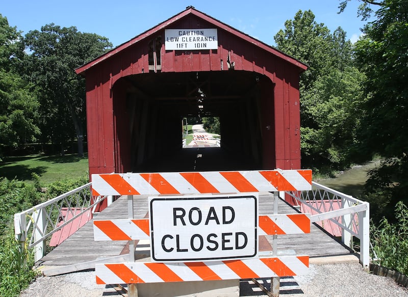 A view of the Red Covered Bridge on Monday, June 30, 2025 in Princeton. Last Friday, the Illinois Department of Transportation announced that the historic bridge enters next rehabilitation phase. Phase II includes the preparation of a detailed cost estimate and expected to take 12 to 18 months to complete and will result in advertising a repair contract to bidders. Approximately $1 million is identified to pay for the needed repairs in IDOT’s most recent multiyear program. A view of the Red Covered Bridge on Monday, June 30, 2025 in Princeton. Last Friday, the Illinois Department of Transportation announced that the historic bridge enters next rehabilitation phase. Phase II includes the preparation of a detailed cost estimate and expected to take 12 to 18 months to complete and will result in advertising a repair contract to bidders. Approximately $1 million is identified to pay for the needed repairs in IDOT’s most recent multiyear program. The bridge survived a number of threats, both intentional and unintentional, including arson, erosion and high winds. It also has survived several strikes by large trucks with it's most recent strike in 2023.