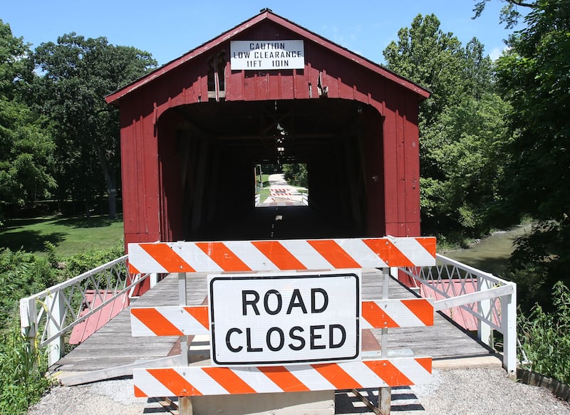 A view of the Red Covered Bridge on Monday, June 30, 2025 in Princeton. Last Friday, the Illinois Department of Transportation announced that the historic bridge enters next rehabilitation phase. Phase II includes the preparation of a detailed cost estimate and expected to take 12 to 18 months to complete and will result in advertising a repair contract to bidders. Approximately $1 million is identified to pay for the needed repairs in IDOT’s most recent multiyear program. A view of the Red Covered Bridge on Monday, June 30, 2025 in Princeton. Last Friday, the Illinois Department of Transportation announced that the historic bridge enters next rehabilitation phase. Phase II includes the preparation of a detailed cost estimate and expected to take 12 to 18 months to complete and will result in advertising a repair contract to bidders. Approximately $1 million is identified to pay for the needed repairs in IDOT’s most recent multiyear program. The bridge survived a number of threats, both intentional and unintentional, including arson, erosion and high winds. It also has survived several strikes by large trucks with it's most recent strike in 2023.