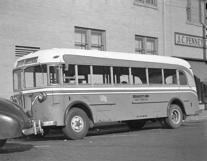DeKalb-Sycamore bus, operated by Dart, shown on the first day at South Third Street and Lincoln Highway looking west, 1946. Dart sold the line in September 1948.