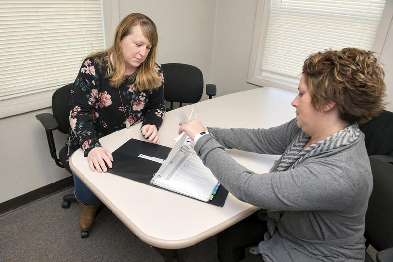 LSSI Prevention Specialists Kelsey Kant (left) and Katie Kalina talks abou the Youth WORKS Program being implemented in Lee, Ogle, Carroll and Whitdeside Counties. The program is an anti-violence and bullying initiative.