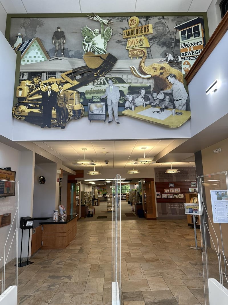 A wood relief mural celebrating the history of Oswego and Montgomery was recently installed near the entrance to the campus, located at 32 W. Jefferson St. in downtown Oswego.