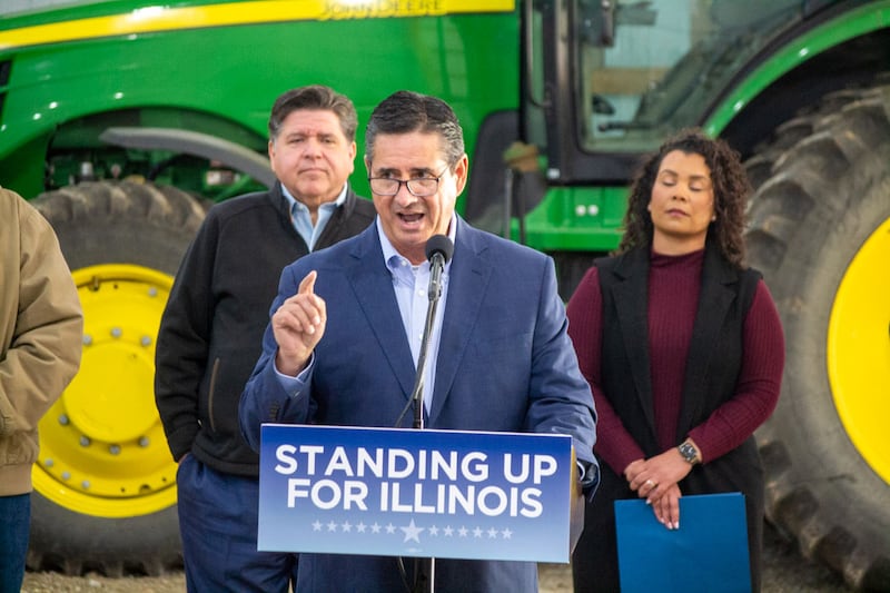 Jerry Costello II, director of the Illinois Department of Agriculture, speaks at a Christian County farm alongside Gov. JB Pritzker (left) and Cameron Joost, assistant director of the Illinois Department of Commerce and Economic Opportunity. The group discussed the impact of tariffs on Illinois farmers in an October visit.