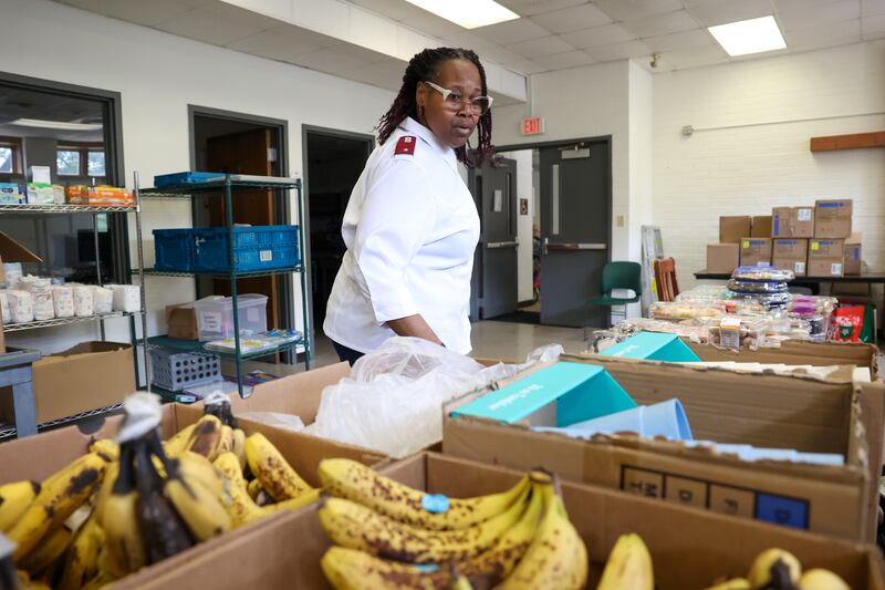 Pastor Lieutenant LaToya Surratt readies the food pantry for individuals in need at The Salvation Army in Kankakee on Tuesday, June 10, 2025. The local branch is facing a severe funding shortage, prompting Surratt to start a summer fundraiser in hopes to collect enough to maintain services.