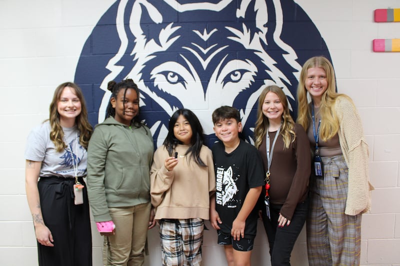 Wesmere Elementary School speech-language pathologist Megan Eberle, fifth graders Londyn Robinson, Olivia Marcos and Hayden Castro, and fifth-grade teachers Ashley Richard and Clara Davidson worked on the inaugural Wolf Pack Podcast released in October 2025.