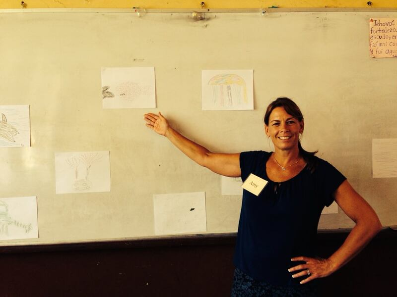 St. Charles educator Amy Kappele poses next to her a white board in a classroom in Nicaragua, where she taught literacy workshops in 2014.