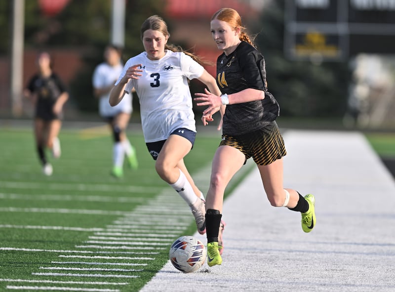 Joliet West's Emma Vugteveen (14) in action during the conference game against Plainfield South on Thursday, April. 24, 2025, at Joliet.