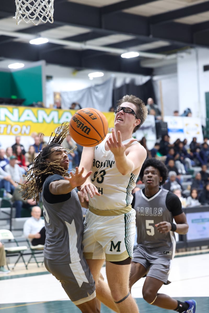 Bishop McNamara's Callaghan O'Connor loses control of the ball under pressure from Hope Academy during the Fightin' Irish's 70-51 loss on Tuesday, Dec. 9, 2025