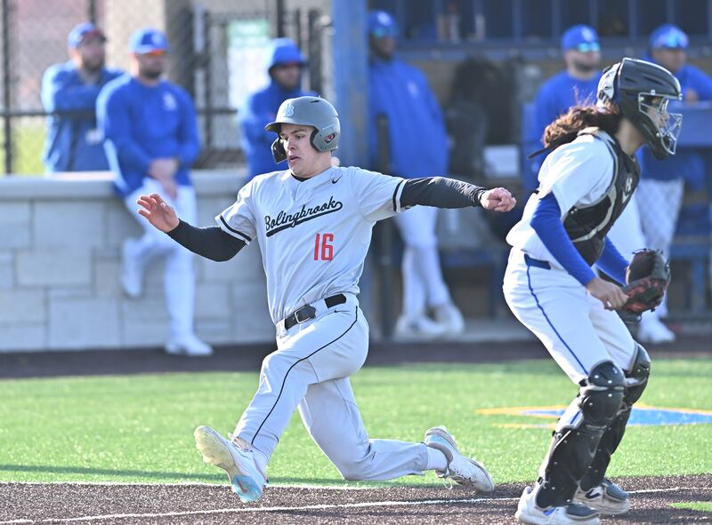 Bolingbrook's Thomas McDermott slides to home plate for a score during the non-conference game against Joliet Central on Thursday, April. 10, 2025, at Joliet.
