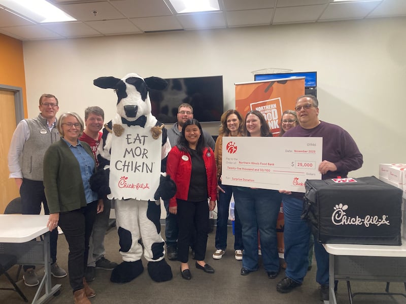 Representatives from Chick-fil-A present a $25,000 check to the Joliet branch of the Northern Illinois Food Bank on Monday, Nov. 24, 2025.