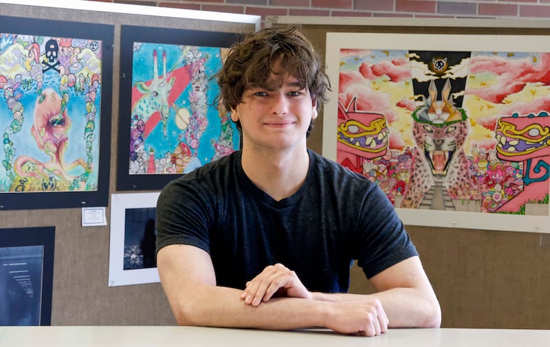 Downers Grove North High School senior Dashiell Speir, with several of his artworks. Speir has been offered $524,000 worth of art-school scholarships, after exhibiting his work in an Illinois High School Art Exhibition this spring.