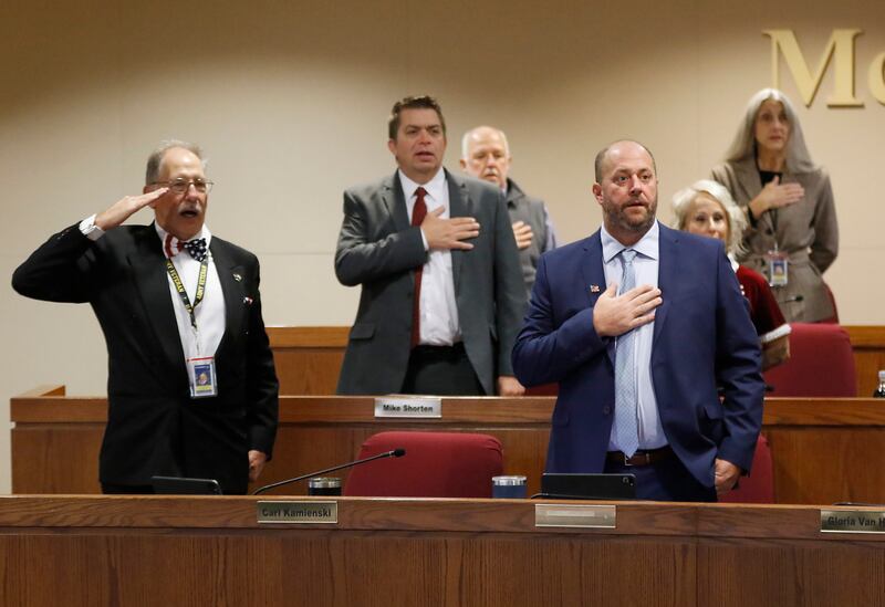 Carl Kamienski (left) leads the McHenry County Board in the Pledge of Allegiance on Monday, Dec. 2, 2024, as the start of board meeting to swear in new board members at the McHenry County Administration Building in Woodstock.