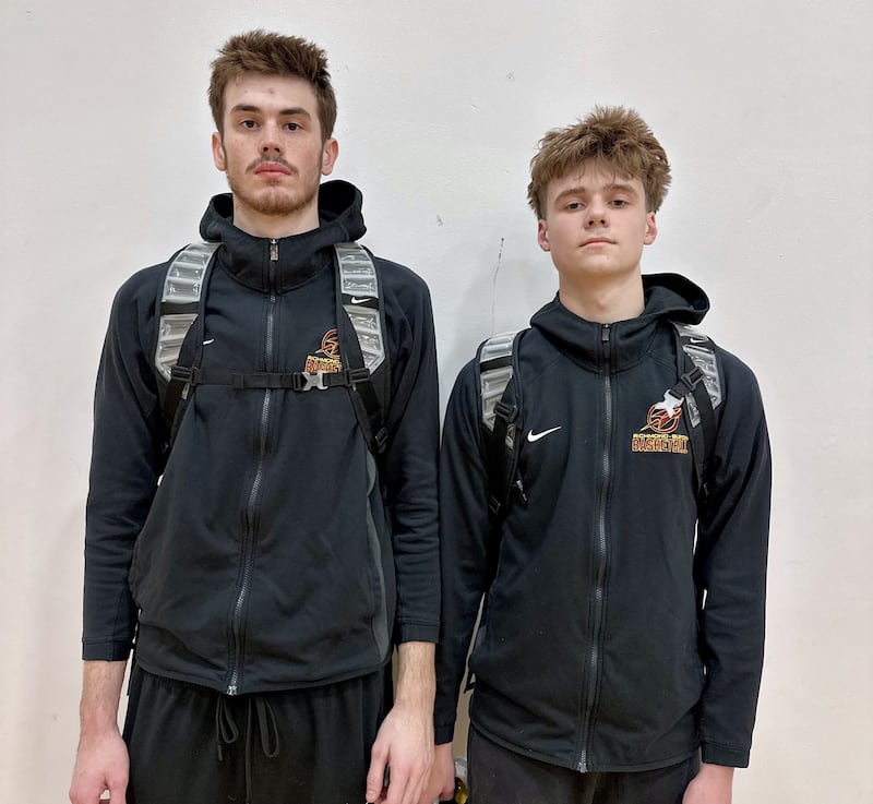 Jace Nelson (left) and Gavin Radmer (right) combined for 26 points and teamed up on the go-ahead layup late in the fourth quarter of Richmond-Burton's regional semifinal win over Timothy Christian.