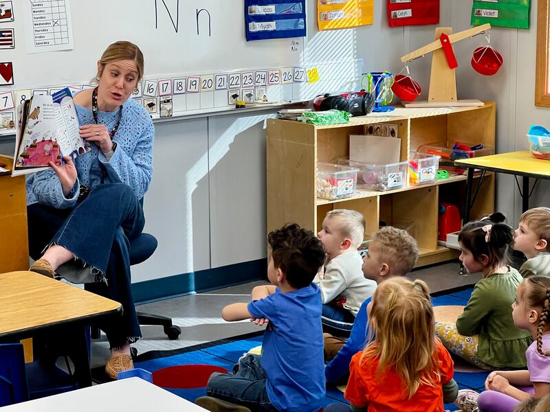 Speech pathologist Cali Miles reads to children at Jefferson Elementary School's pre-kindergarten center in Sterling on Friday, Feb. 28, 2025.