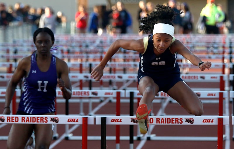 Cary-Grove’s Olivia Parker (right) wins the 100 meter hurdles on Thursday, May 7, 2026, during the Fox Valley Conference Girls Track and Field Meet at Huntley High School.