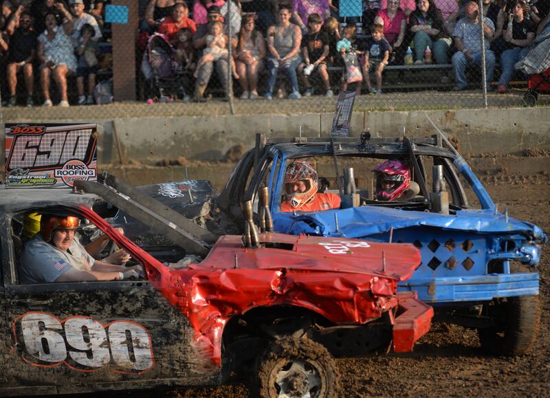 Aubree Boss, 12, and her dad Brick (blue car) crash into Abby Boss, 17, of Rock Falls, and her passenger, Travis, during the Young Gun heat at the Ogle County Fair's demolition derby on Saturday, Aug. 2, 2025.