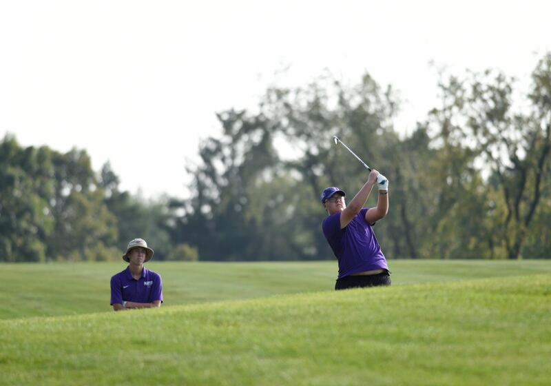 Manteno's Carson Russert shoots for the green at Minne Monesse Golf Club as Landon Bukowski watches on Friday, August 15, 2025.