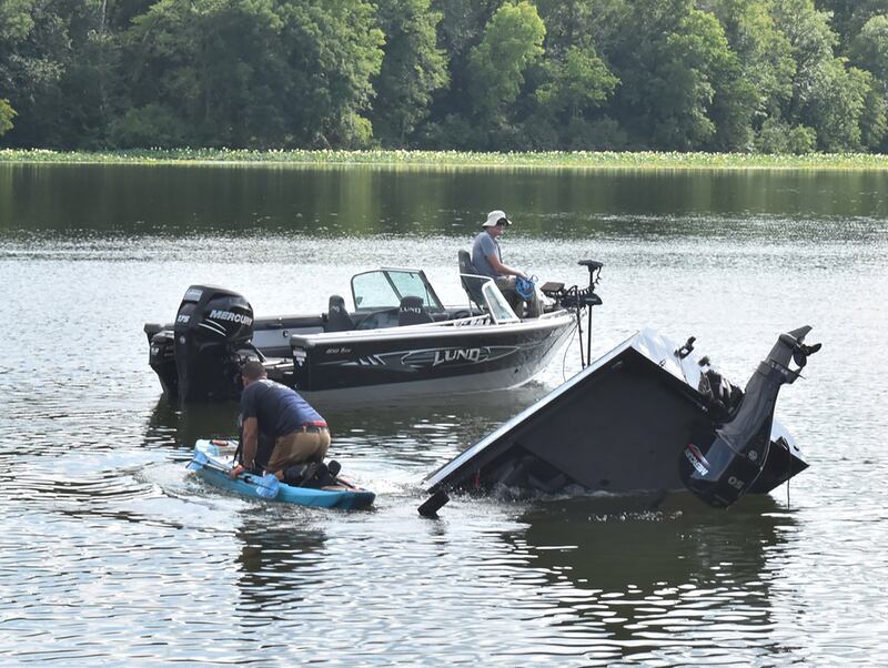 Morrison firefighters work to pull a truck, boat and trailer from the lake at Morrison Rockwood State Park near Morrison on Friday, July 18, 2025. No one was injured after the truck accidentally entered the lake at the boat ramp.