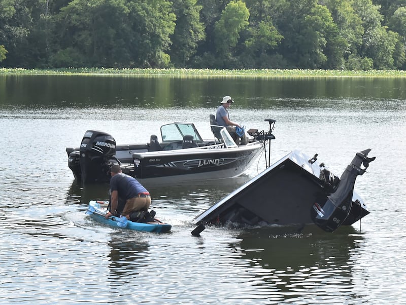 Morrison firefighters work to pull a truck, boat and trailer from the lake at Morrison Rockwood State Park near Morrison on Friday, July 18, 2025. No one was injured after the truck accidentally entered the lake at the boat ramp.