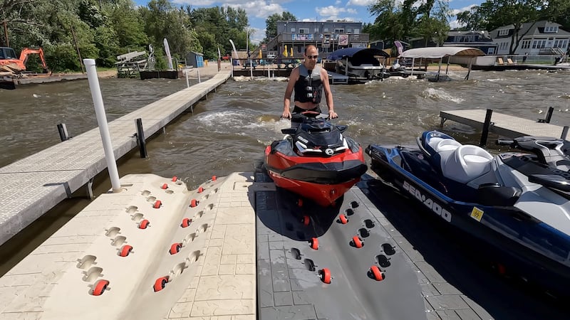 Mike Missak, of McHenry, pulls his PWC onto one of the floating ports at The Beach House on Fox Lake. It is one of seven locations with "parking" for personal watercraft installed with the help of Nielsen Enterprises.