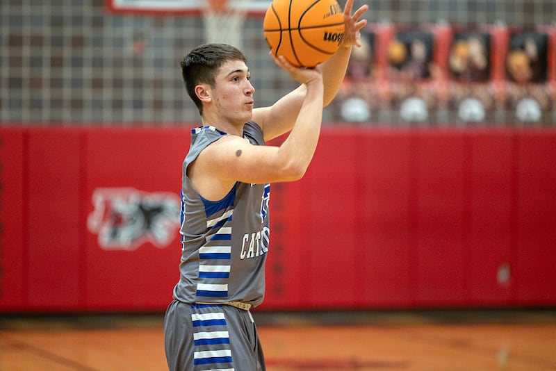 Newman’s Evan Bushman puts up a three-pointer against Riverdale Tuesday, Dec. 30, 2025, in the final of the boys Cliff Warkins Basketball Tournament at Erie High School.