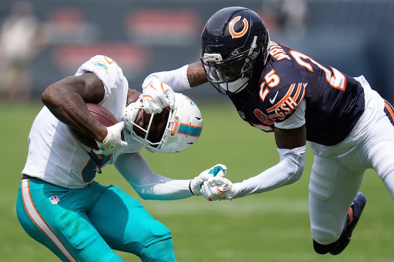 Chicago Bears cornerback Nahshon Wright, right, defends Miami Dolphins running back Alexander Mattison (8) during the first half of an NFL preseason football game, Sunday, Aug. 10, 2025, in Chicago. (AP Photo/Erin Hooley)