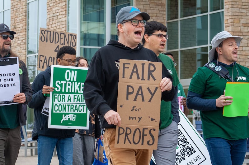 Striking faculty members, family and supporters picketing on the University of Illinois Springfield’s campus. The faculty union has been in negotiations with the university for almost a year and voted to authorize a strike in late March.