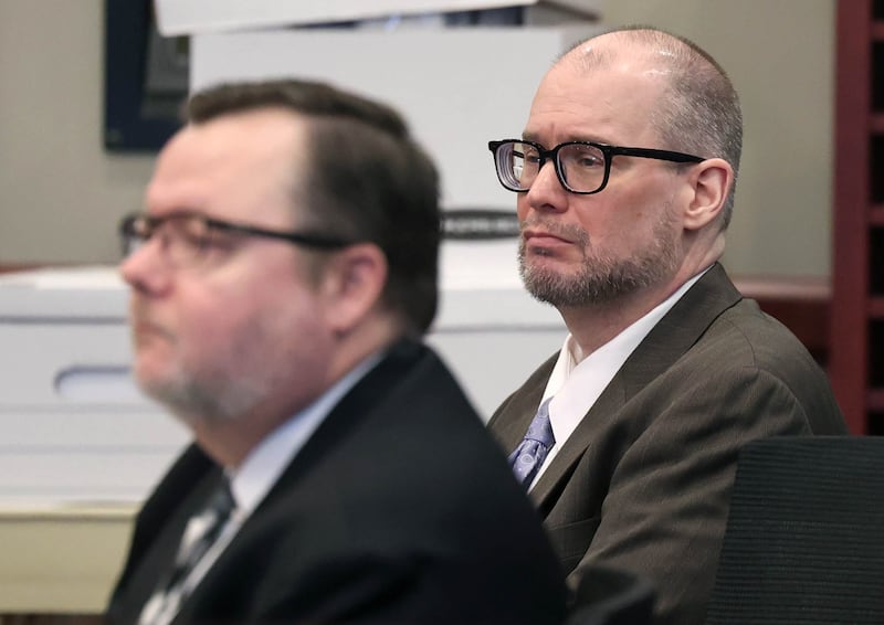 Jonathan Hurst (right) along with his attorney Chip Criswell listen to opening arguments Thursday, Jan. 23, 2025, during his trial at the DeKalb County Courthouse in Sycamore. Hurst is charged in the 2016 killings of elderly mother and son Patricia and Robert Wilson of Sycamore.