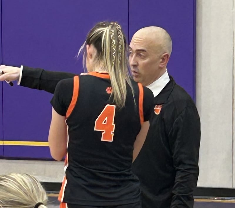 Byron coach Eric Yerly makes a point to a player in Thursday's sectional championship 60-36 victory over Riverale at Mendota. He is a Hall High School alum.