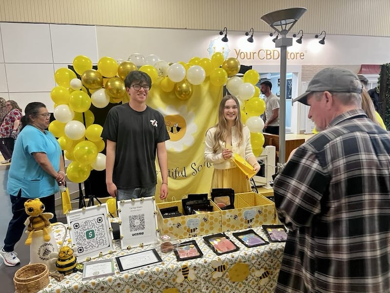 Rock Falls High School senior Carolyn Masini greets customers at her business, Bee-utiful Scents, in Sterling's Northland Mall at the Whiteside Area Career Center's CEO program student trade show on April 23, 2025.