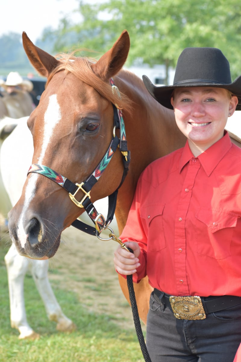 Molly Ziegler waits for her class with her horse, Luva Masquerade Party.