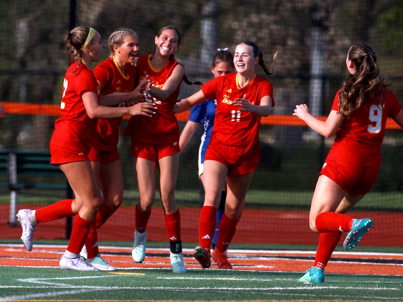 Batavia's Leah Zimberoff (center) celebrates her goal during a Tri-Cities Soccer Night game against Geneva on Tuesday, April 29, 2025 at St. Charles East.