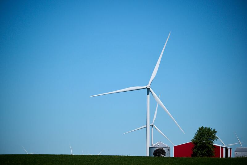 A general view of wind turbines on farmland with a large red barn in rural Gibson City in east-central Illinois.