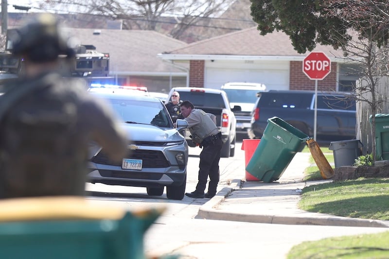 A police officer at the scene of a barricade situation on Joliet's west side Monday, March 30, 2026. Will County and Joliet police officers responded to the scene following a person fleeing after they crashed their vehicle following a traffic stop.
