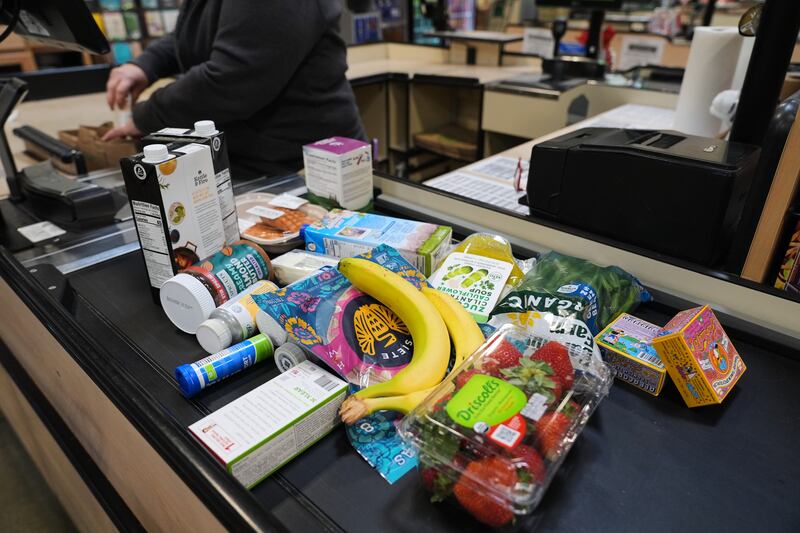 A cashier scans groceries, including produce, which is covered by the USDA Supplemental Nutrition Assistance Program (SNAP), at a grocery store in Baltimore, Monday, Nov. 10, 2025. (AP Photo/Stephanie Scarbrough)