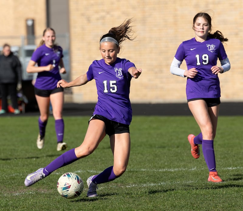 Dixon’s Jenna Harrison takes a shot against North Boone  Tuesday, April 15, 2025.