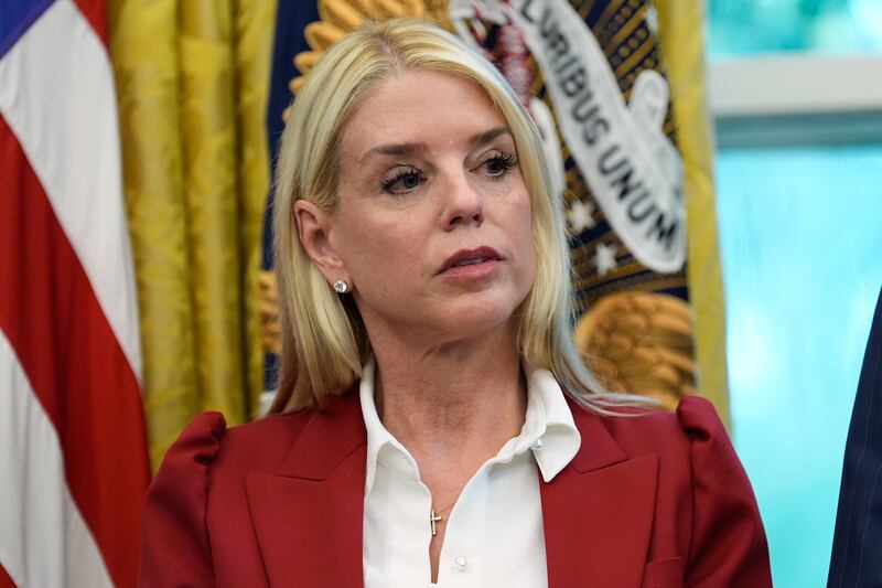 Attorney General Pam Bondi listens as President Donald Trump signs a presidential memorandum on the death penalty in the District of Columbia in the Oval Office at the White House, Thursday, Sept. 25, 2025, in Washington. (AP Photo/Alex Brandon)