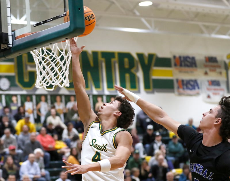 Crystal Lake South's Anthony Demirov drives to the basket against Burlington Central's LJ Kerr during a Fox Valley Conference basketball game on Tuesday, Jan. 28, 2025, at Crystal Lake South High School.