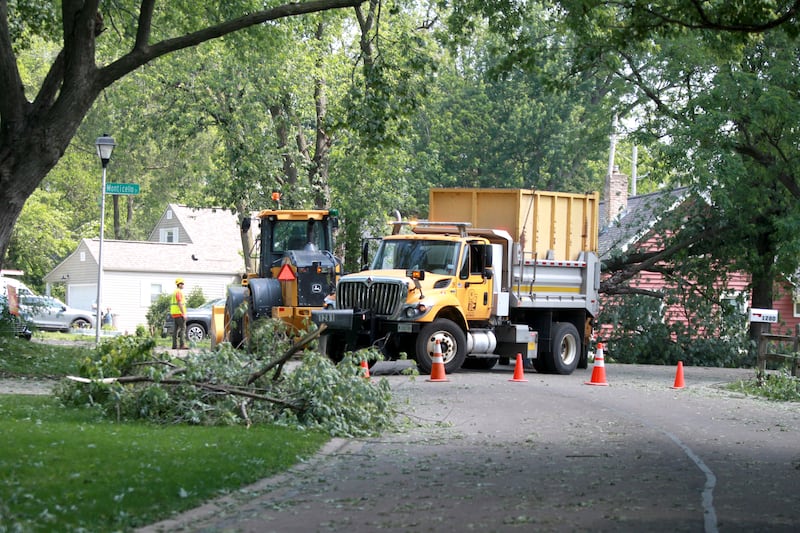 Crews clear trees after storms in Batavia on Sunday, June 8, 2025 left trees and power lines down throughout the city.