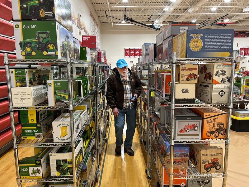 Gerald Kersten of Ashton walks between two rows of farm toys at the Forreston FFA Alumni's Farm Toy and Craft Show on Saturday, March 8, 2025 at the Forreston High School.