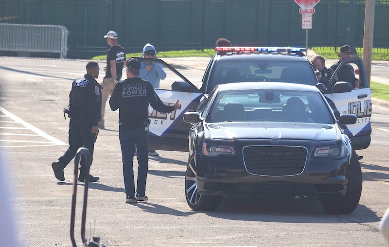 Film crews and actors for the HBO TV pilot "Amercian Blue" near the Joliet Slammers baseball stadium on Tuesday, April 28, 2026, on East Van Buren Street in Joliet.