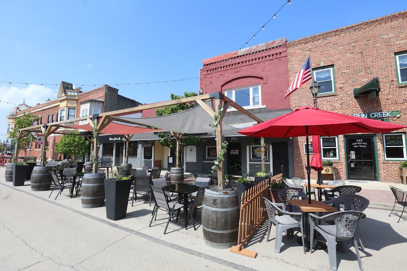 Utica businesses kicked off the outdoor dining season by setting up patio furniture, flowers, decorations and canopies on Thursday, May 8, 2025 for customers on Mill Street downtown Utica. The outdoor dining season on Mill Street runs through October.