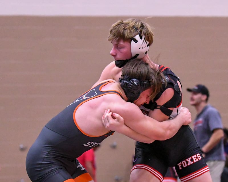 Caleb Viscogliosi, right of Yorkville wrestles against Ben Guskiewicz of St. Charles East in the 175-weight class during the Flavin Invite on Tuesday Dec. 30, 2025, held at DeKalb High School.