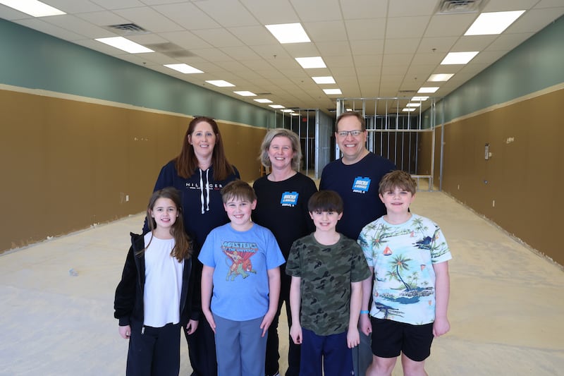 Karen Sorensen, back left, and her children Serena and Carter, of Beecher,
stand with Christena and Cory Estby, back right, and their children Josiah and Samuel, in the future site of Bradley's new Bricks & Minifigs, at 2020 Bradley Boulevard. Members of the ownership team not pictured are Karen's husband, Erik Sorensen, and Christena and Cory's son, Gabriel.