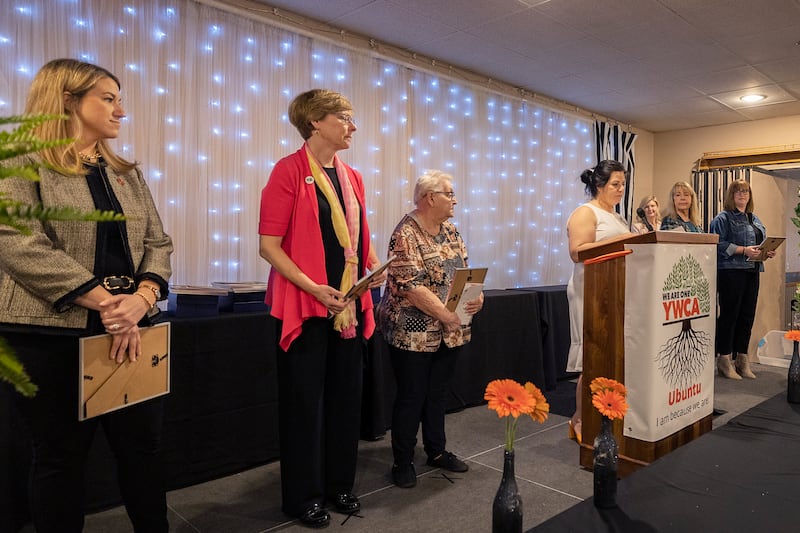 YWCA Executive Director Rebecca Munoz-Ripley (middle) starts the ceremony Thursday, April 18, 2024 for the 41st YWCA Women of Achievement Luncheon.