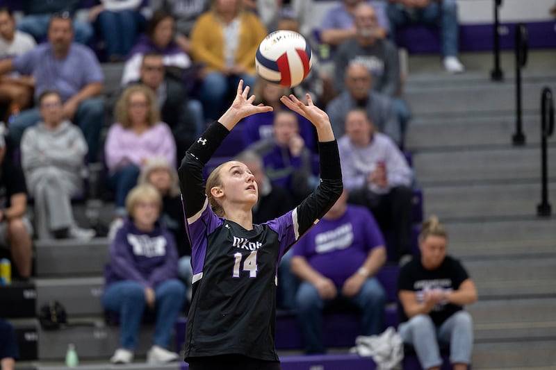 Dixon’s Leah Carlson sets against Rochelle Monday, Oct. 28, 2024, during regional play in Dixon.