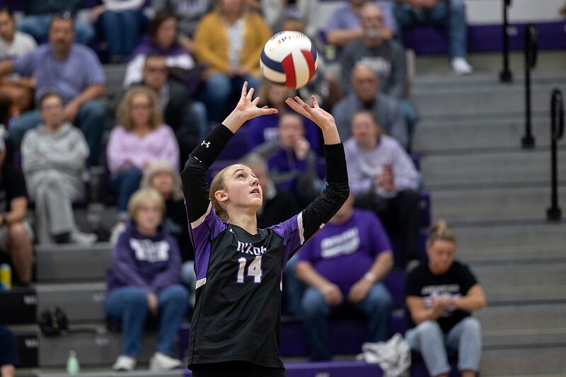 Dixon’s Leah Carlson sets against Rochelle Monday, Oct. 28, 2024, during regional play in Dixon.