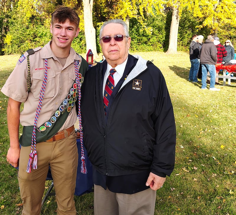 New Eagle Scout Ayden Marsek stands with Eliseo Lopez, commander of the Chicago chapter of MOWW, at Marek's Eagle Court of Honor event.