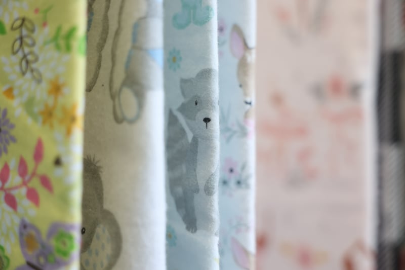 Baby blankets and quilts hang at The Sewing Cafe on Thursday, Jan. 25th, 2024 in Joliet.