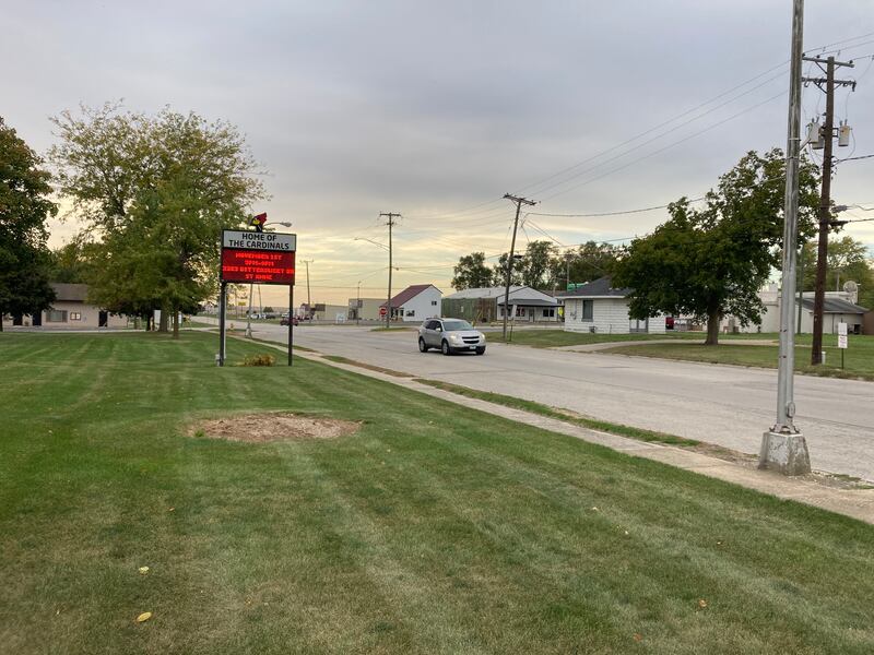 A car drives east on Guertin Steet in front of St. Anne High School. Kankakee County