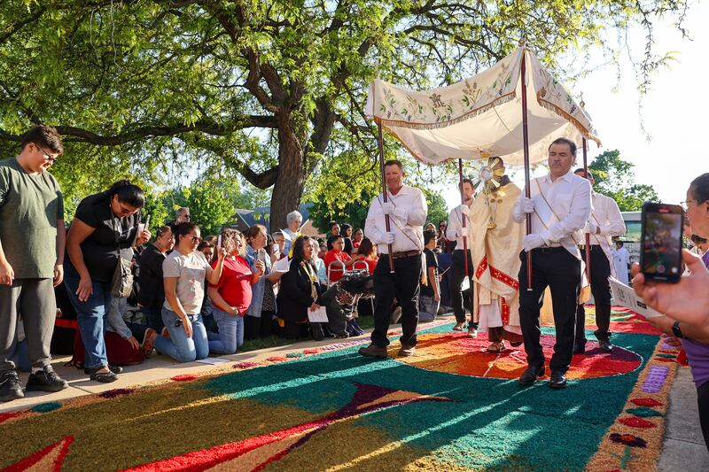 The Rev. Matthew Pratscher, pastor of St. John Paul II, carries the Eucharist in the monstrance as the National Eucharistic Pilgrimage arrived to St. John Paul II parish grounds on Sunday, May 18, 2025.